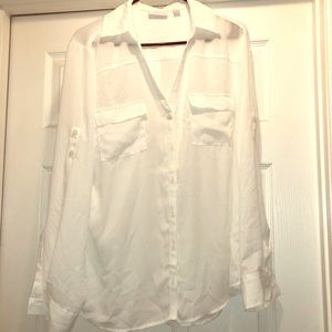 All white button down blouse.
